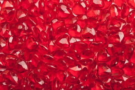 A frame filling macro of some red plastic hearts.の写真素材