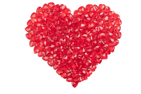 A number of plastic hearts arranged into the shape of a heart.  Isolated on white.の写真素材