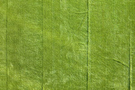 A full frame shot from above of some very badly laid artificial turf.の写真素材