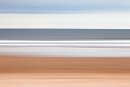 A panning shot of the beach at Warkworth, Northumberland.の写真素材