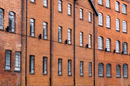 A large number of windows on an old industrial building in Englandの写真素材