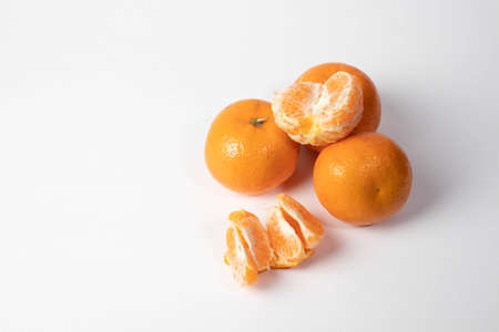 peeled tangerine on a white backgroundの写真素材
