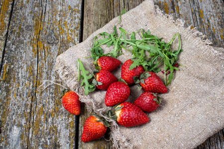 on old strawberry slices on fabricの写真素材
