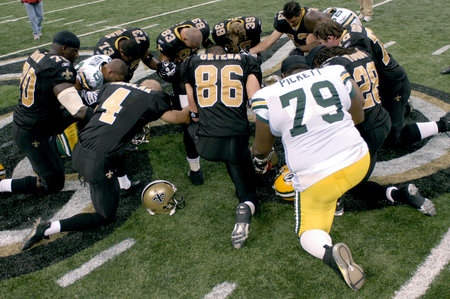 Post game prayer by members of the New Orleans Saints and Green Bay packers at the Louisiana Superdome Nov 24, 2008のeditorial素材