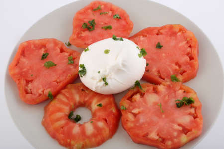 tomato and mozarella salad with basil leaf