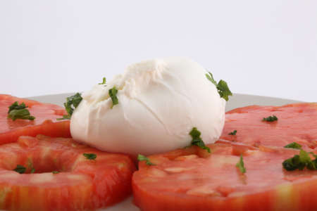 tomato and mozarella salad with basil leaf