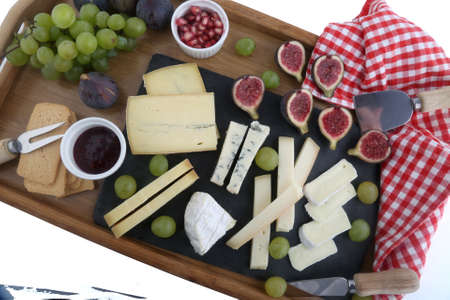 cheese board variety with grapes and figs