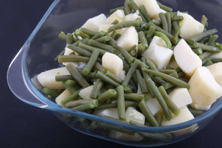 boiled potatoes and green beans as healthy vegan foodの写真素材