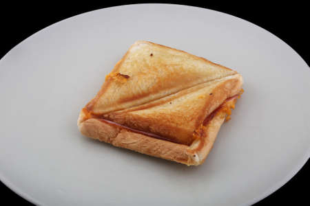 hot bread toast sandwich with cheese and ham or sobrasadaの写真素材