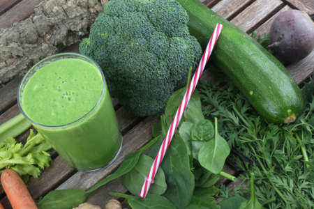 detox green juice with broccoli spinach and fruitsの写真素材