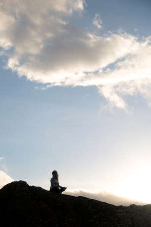 outdoors yoga meditation silhouette in the sky