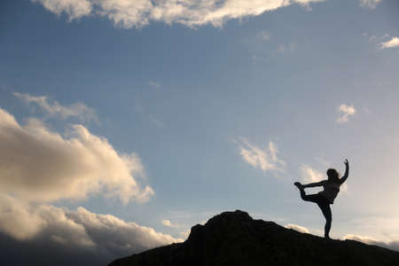 outdoors yoga meditation silhouette in the sky