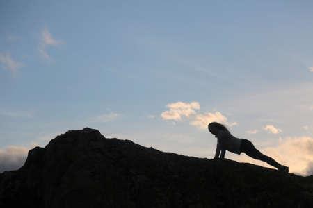 woman push upsin the mountain outdoorsの写真素材