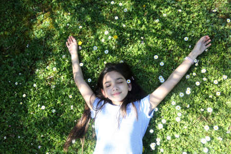 young brunette girl portrait outdoorsの写真素材