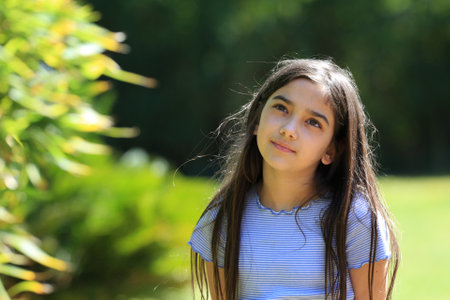 young brunette girl portrait outdoors