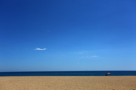 Beach and sea in sunny day with blue sky and white cloudsの写真素材
