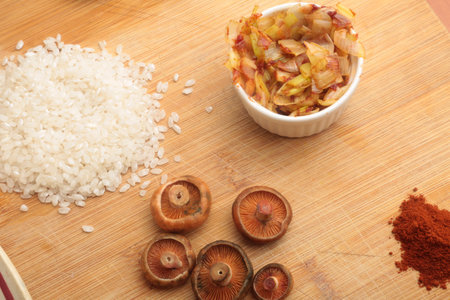 Rice and pickled mushrooms on a cutting board, top viewの写真素材