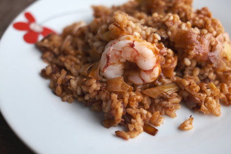Prawns with rice on a white plate, close-upの写真素材