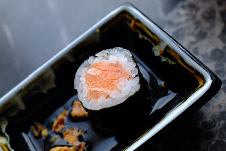 Sushi roll with salmon, japanese food on black backgroundの写真素材
