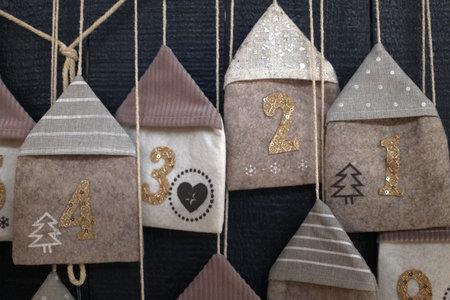 Hanging christmas ornaments on rustic wooden background.の写真素材