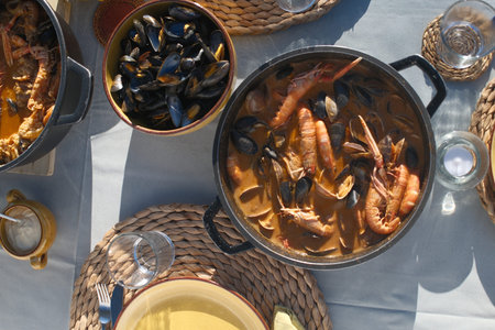 Top view of traditional seafood paella in pot on table.の写真素材