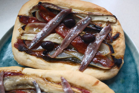 Pizza with mushrooms and onions on a plate. Close-up.の写真素材