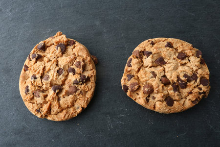 Chocolate chip cookies on slate background. Top view with copy spaceの写真素材