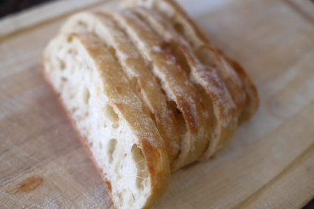 Bread on the cutting board close-up, selective focus.
