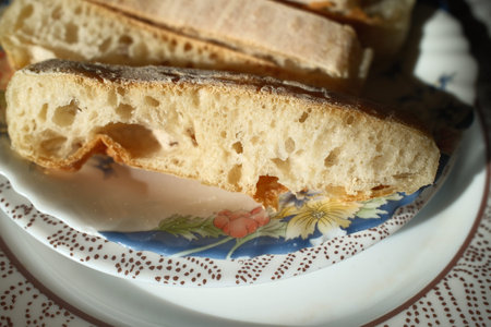Close up of a ciabatta sandwich on a plate.