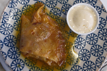 Cabbage rolls with sour cream and mayonnaise on a plateの写真素材