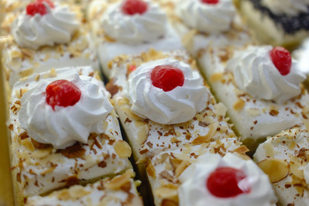 Cake with cream and cherries. Close up. Selective focus.