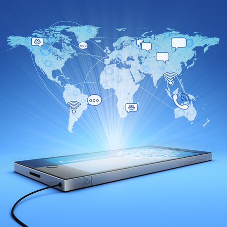 mobile phone projects world map into the airの写真素材