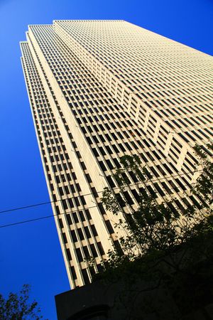 Skyscrapers in blue sky: Complimentary natural and artificial beautyの写真素材