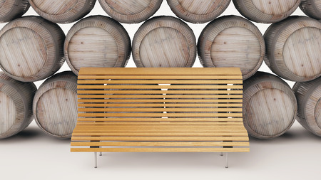 Bench standing frontally against backdrop of beautiful wine barrelsの写真素材