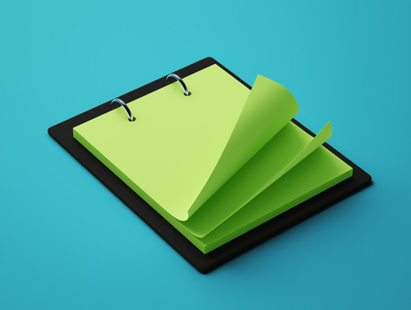 Blank Green Paper Notepad isolated on blue backgroundの写真素材