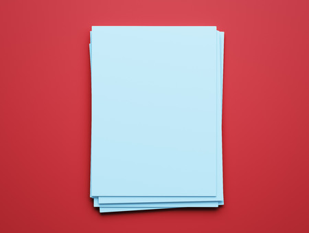 Blank Blue Paper Notepad isolated on red backgroundの写真素材