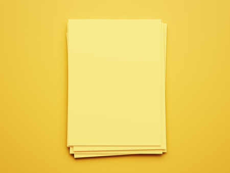 Blank Yellow Paper Notepad isolated on yellow backgroundの写真素材