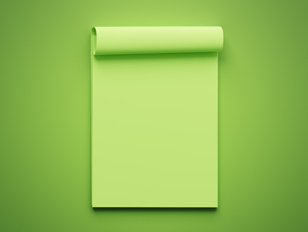 Blank Green Paper Notepad isolated on green backgroundの写真素材