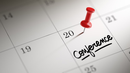Concept image of a Calendar with a red push pin. Closeup shot of a thumbtack attached. The words Conference written on a white notebook to remind you an important appointment.の写真素材