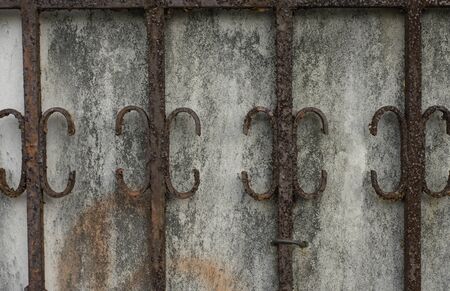 old  cage with rusty  in the wall use for a background の写真素材