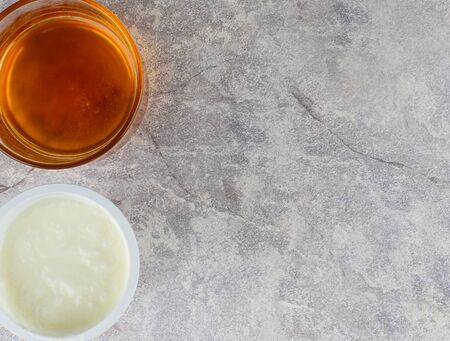 Yogurt  face mask DIY for skin care on white concreteの写真素材