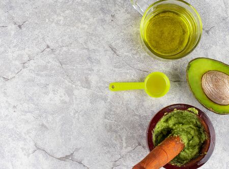 Avocado face mask ingredient   on the white concreteの写真素材