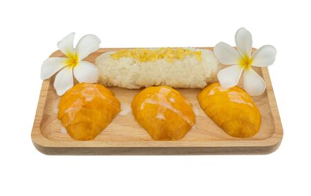 Mango with sticky rice dessert on wooden tray in whiteの写真素材