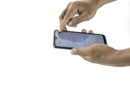 man catching up the online news on his mobile isolated on white background