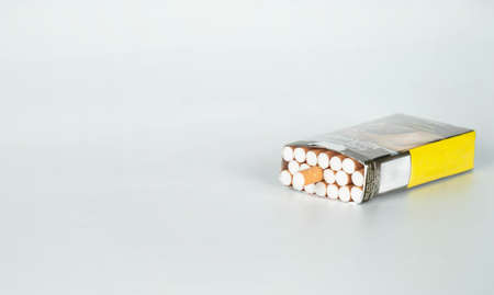 cigarette inside package isolated on white background.の写真素材