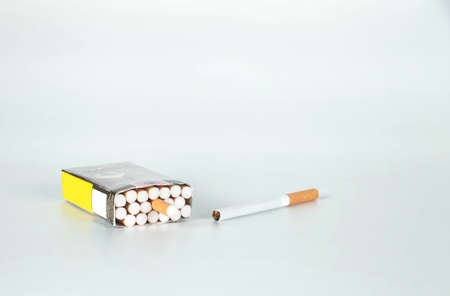 cigarette lay on a white backgroundの写真素材