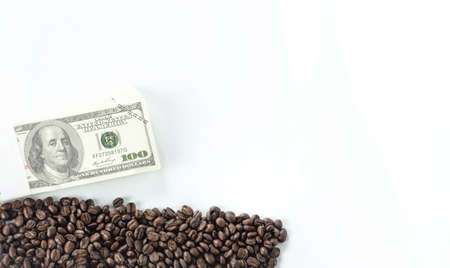 coffee and banknote isolated on white background use for concept coffee trading.の写真素材