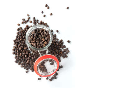 glass bottle with coffee beans isolated on white background from top viewの写真素材
