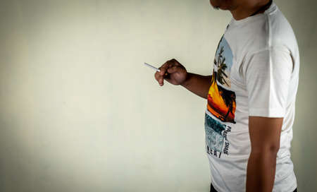 man holds cigarette on hands concept for narcotic  or crime.