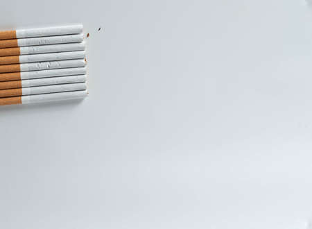 stack of cigarettes isolated on white background from top view with copy spaceの写真素材